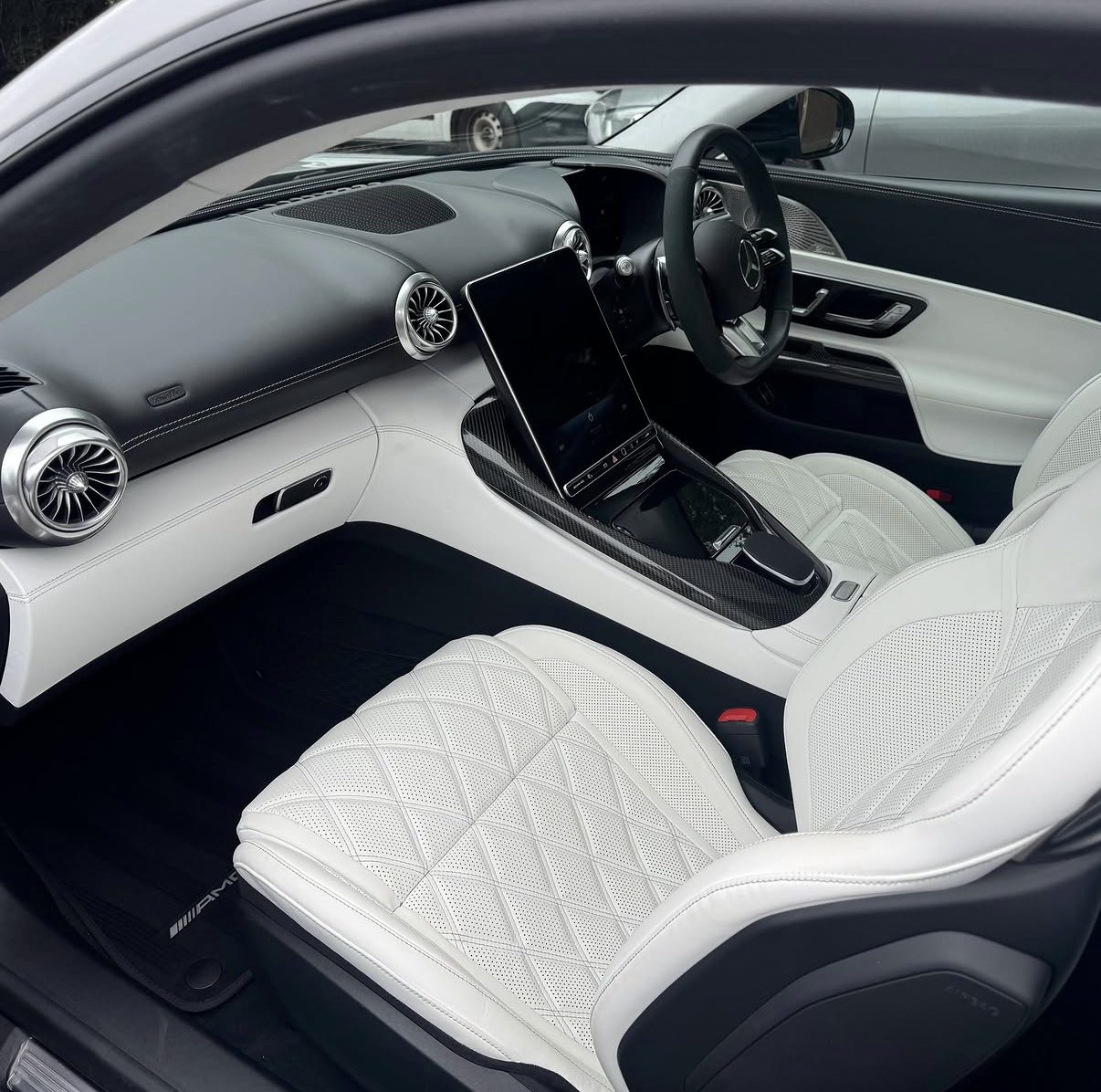 White quilted leather seats in a Mercedes-AMG GT