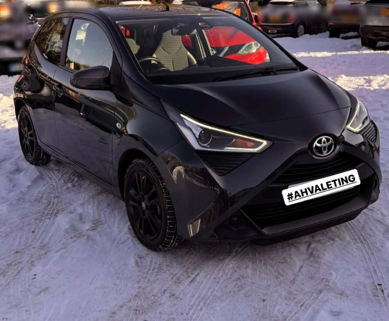 Black Toyota Aygo in the snow